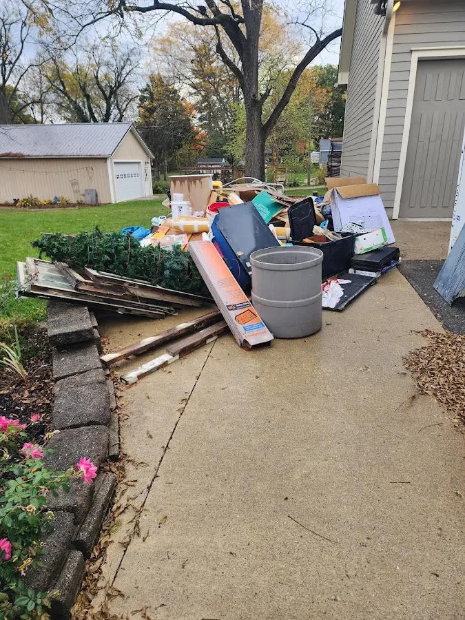 Dumpster being loaded with debris for Commercial Dumpster Rental in Horn Lake